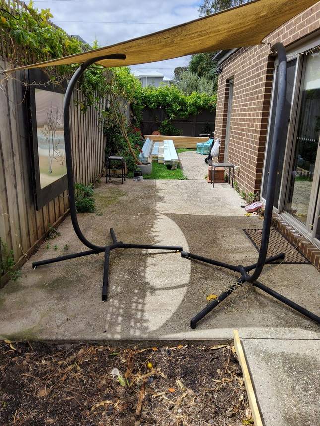 Living zone before — sail shade stand on bare concrete, Heidelberg
