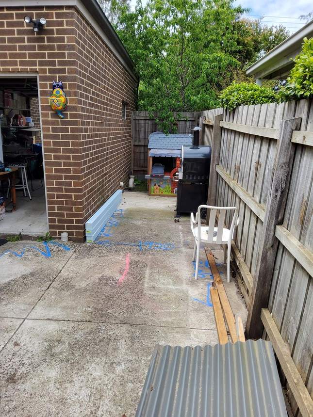 Kitchen zone before — cubby and BBQ on concrete, Heidelberg