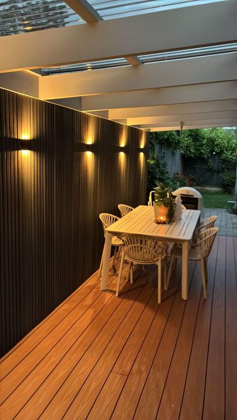 Living zone dining at dusk — Heidelberg twin pergola transformation