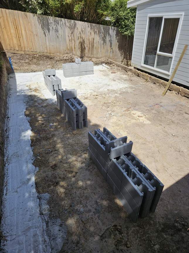 Besser blocks delivered and staged ready for the retaining wall