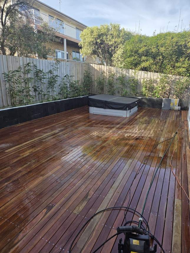 Wide shot of completed merbau deck with spa visible