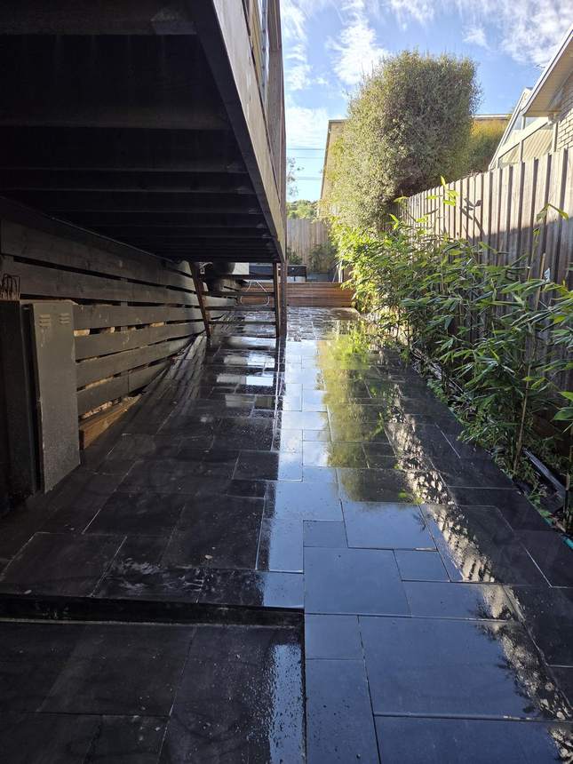 Completed bluestone wall face with stairs and bamboo overhead