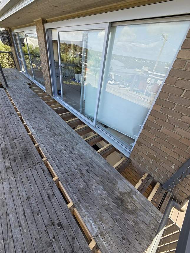 Original weathered timber deck with steel cable balustrade — Jan Juc before works