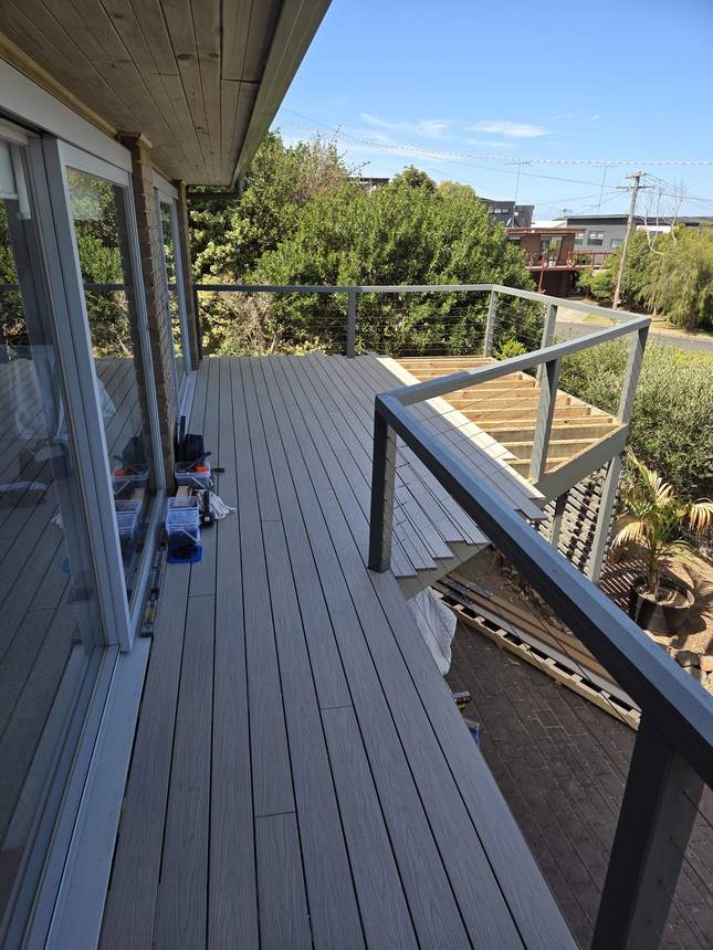 Old steel cable stripped out from between the deck posts, bays opened up ready for the new aluminium balustrade — Jan Juc
