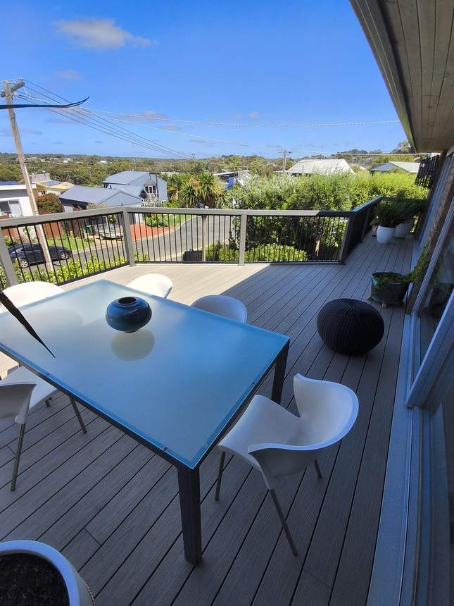 Looking out from the deck — Ash Grey composite boards and aluminium frame balustrade, Jan Juc