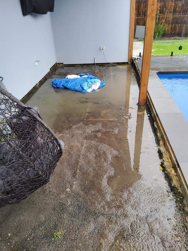 Water pooling beside pool before drainage and deck installation — Pakenham, My Home My Garden
