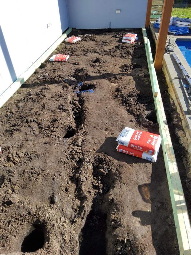 Excavation face alongside pool edge — drainage failure exposed, Pakenham