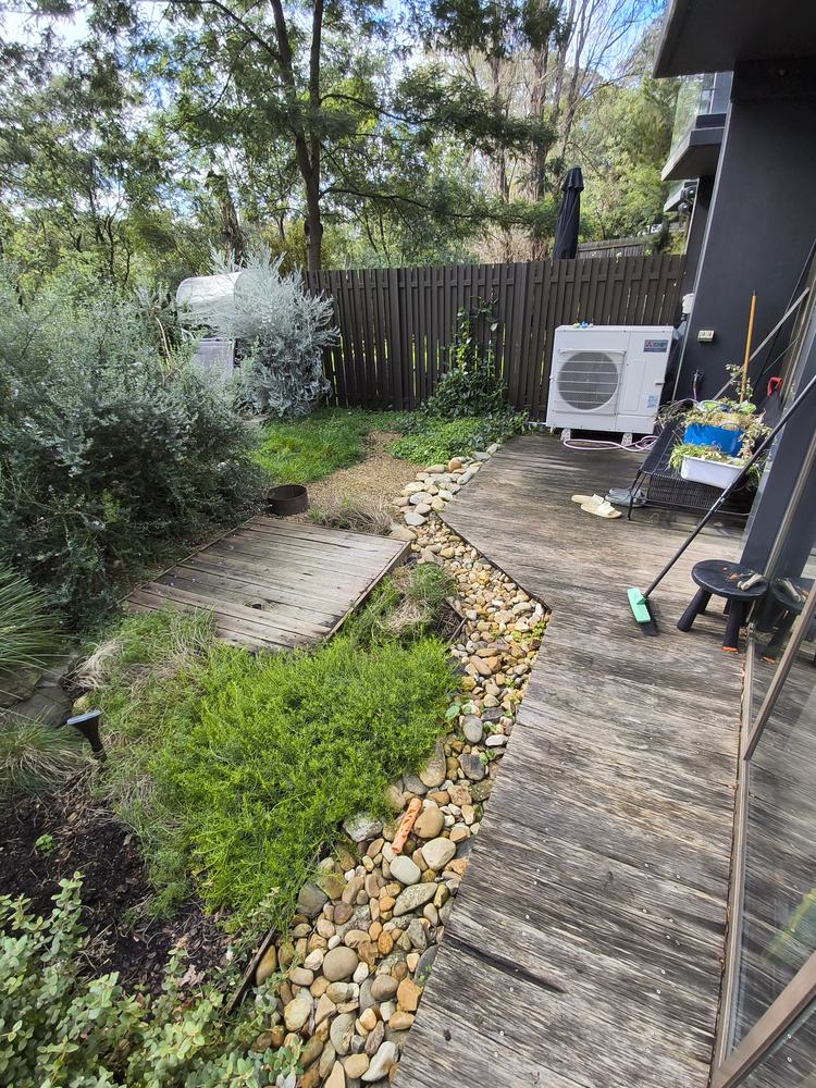 Old weathered timber deck and garden boardwalk before the rebuild, Ringwood