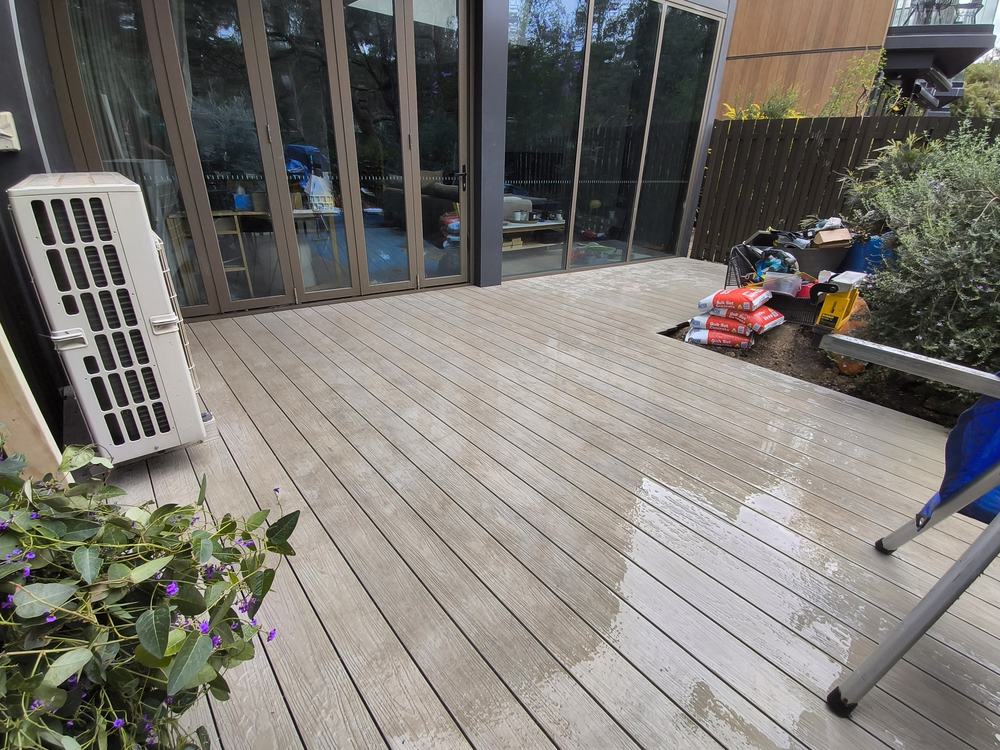 Composite deck fully boarded from the house into the extension