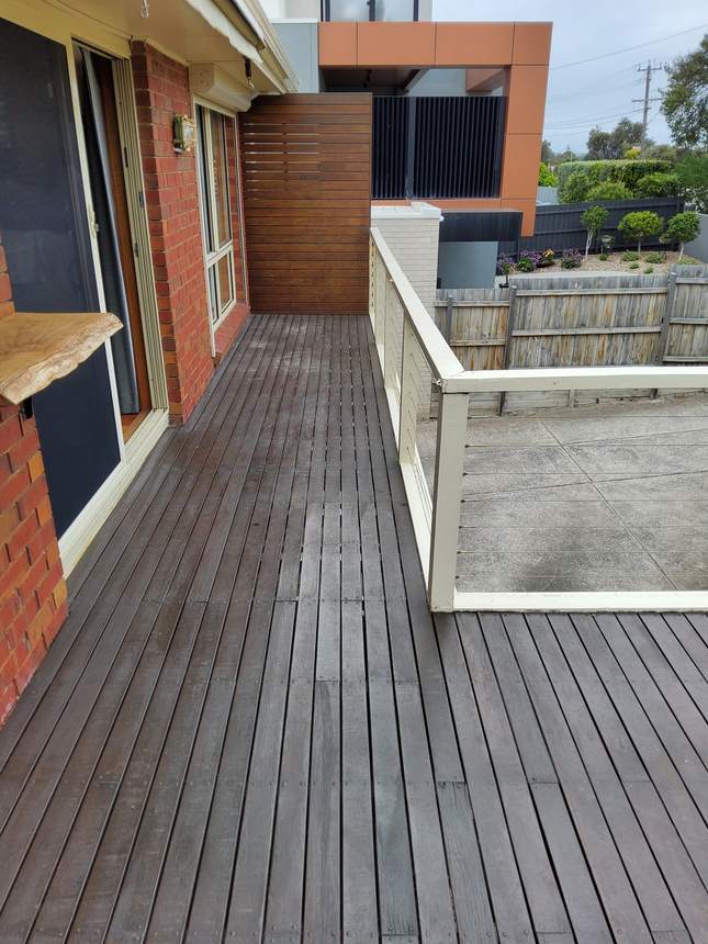 Before: old weathered composite boards on the existing deck — Seaford