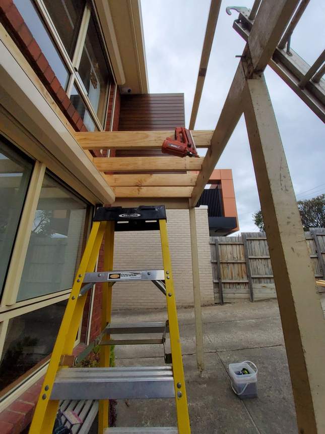 Subframe framing early morning — joists and saddle brackets being fitted throughout, Seaford