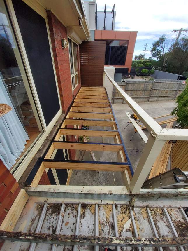 Joist protection tape and saddle brackets — screwed and nailed at every connection, Seaford