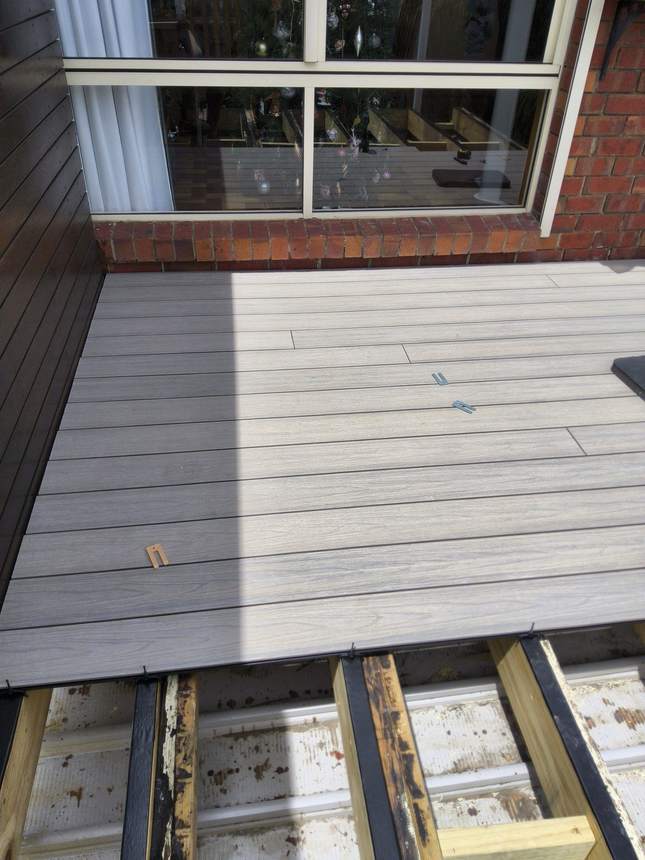 The rebuilt timber subframe — new joists, protection tape and saddle brackets, Seaford