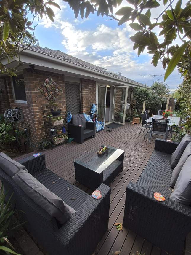 Existing uncovered composite deck with lounge furniture before the pergola — Surrey Hills