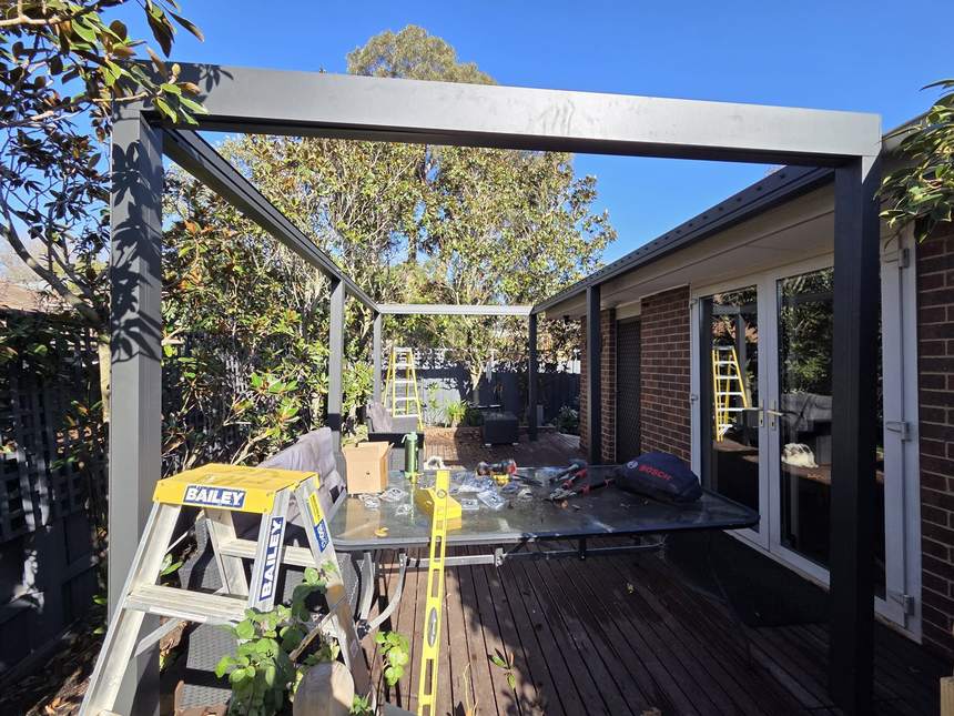 Pergolux Sundream pergola frame, posts and beams spanning the deck — Surrey Hills