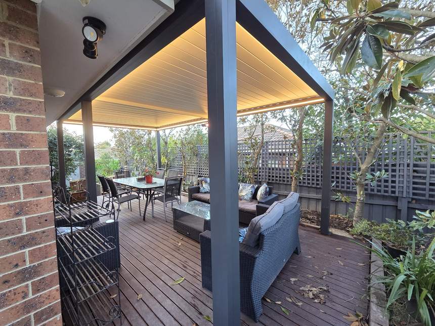 Finished Pergolux louvred pergola over the deck with lounge furniture — Surrey Hills