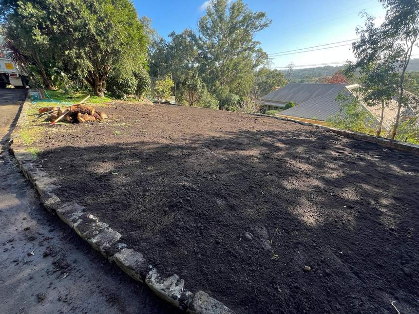 Finished concrete sleeper retaining wall along the boundary — Templestowe