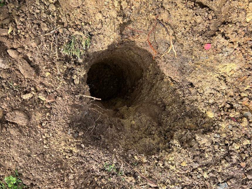 Post footing bored deep into the clay for a steel wall post — Templestowe