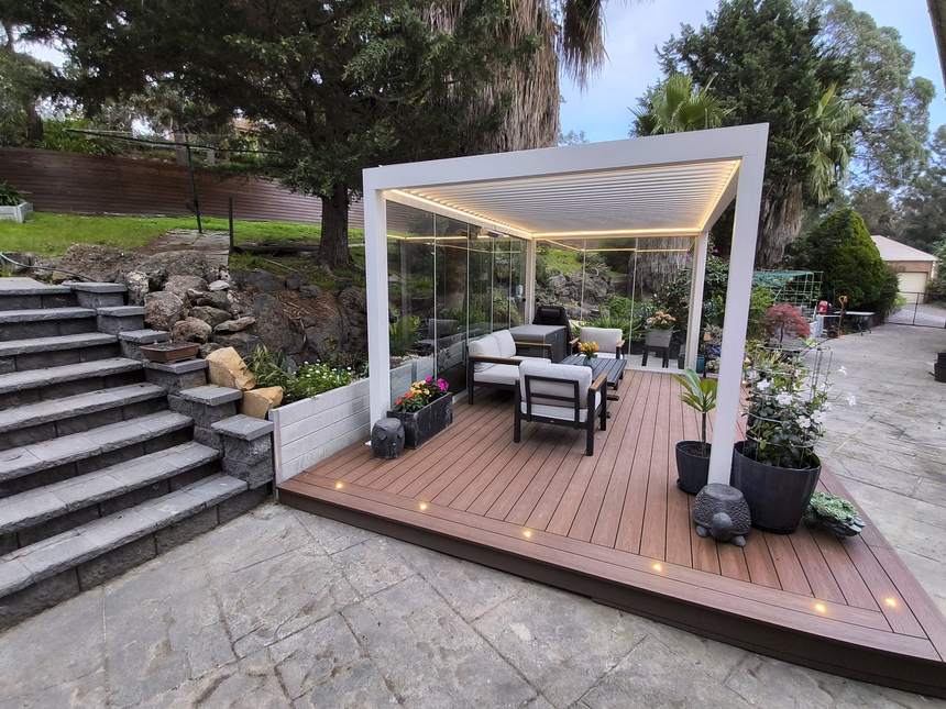 Pergolux louvred pergola with glass walls and herringbone composite deck — Templestowe
