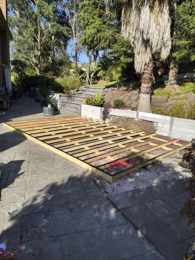 Joist protection tape on every bearer — pergola footing positions marked, Templestowe